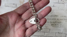Carica e avvia il video nel visualizzatore di galleria, Vintage 1964 Sterling Silver Heart Padlock Curb Bracelet