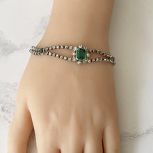 Cargar imagen en el visor de la galería, Antique Art Deco Paste Diamond & Emerald Bracelet. 1920s Sterling Silver Articulated Bracelet. Emerald Cut Green Gemstone Bracelet.