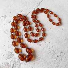 Cargar imagen en el visor de la galería, Antique Art Deco Baltic Amber Long Necklace. Large Faceted Olive Bead Genuine Amber Necklace. 1930s Vintage Cognac Amber 40" Rope Necklace