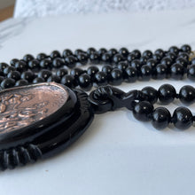 Cargar imagen en el visor de la galería, Vintage Art Deco Galalith & Bronze Pendant Necklace. 1930s Black Bakelite 30" Long Statement Necklace. Greek God Medallion Pendant Necklace.