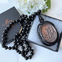 Cargar imagen en el visor de la galería, Vintage Art Deco Galalith & Bronze Pendant Necklace. 1930s Black Bakelite 30" Long Statement Necklace. Greek God Medallion Pendant Necklace.