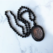 Cargar imagen en el visor de la galería, Vintage Art Deco Galalith & Bronze Pendant Necklace. 1930s Black Bakelite 30" Long Statement Necklace. Greek God Medallion Pendant Necklace.
