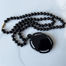 Cargar imagen en el visor de la galería, Vintage Art Deco Galalith & Bronze Pendant Necklace. 1930s Black Bakelite 30" Long Statement Necklace. Greek God Medallion Pendant Necklace.