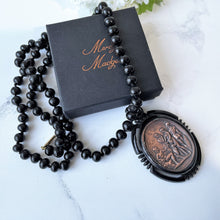 Cargar imagen en el visor de la galería, Vintage Art Deco Galalith & Bronze Pendant Necklace. 1930s Black Bakelite 30" Long Statement Necklace. Greek God Medallion Pendant Necklace.