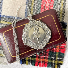 Cargar imagen en el visor de la galería, Vintage Scottish Silver Highland Fling Fob Pendant Necklace. Large Engraved Thistle, Rose & Shamrock Scottish Dancing Medal Dated 1954.