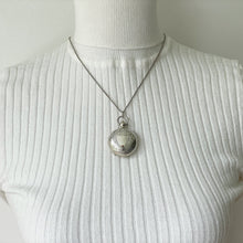 Lade das Bild in den Galerie-Viewer, Antique English Silver Sovereign Case Locket Pendant Necklace. Edwardian Forget-Me-Not Engraved Round Puffy Keepsake Locket Pendant On Chain