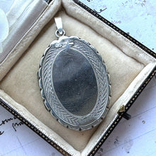 Load image into Gallery viewer, Antique Victorian Sterling Silver Engraved Ivy Locket Pendant. Large Ornate Flat Oval Photo Locket. Aesthetic Engraved Sweetheart Locket
