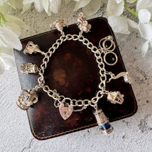 Charger l&#39;image dans la galerie, Vintage 1970s Georg Jensen Sterling Silver Curb Chain Charm Bracelet With 9 Charms &amp; Heart Padlock Clasp, All Original
