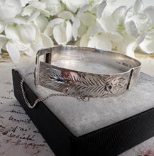 Load image into Gallery viewer, Vintage English Sterling Silver Buckle Bangle Bracelet. Floral Engraved Sterling Silver Victorian Style Belt &amp; Buckle Bangle, 1977 Hallmarks
