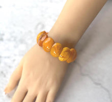 Load image into Gallery viewer, Antique Genuine Baltic Amber Panel Bracelet. Art Deco Carved Egg Yolk Amber Stretch Bracelet. Natural Untreated Amber Bracelet
