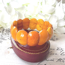 Load image into Gallery viewer, Antique Genuine Baltic Amber Panel Bracelet. Art Deco Carved Egg Yolk Amber Stretch Bracelet. Natural Untreated Amber Bracelet
