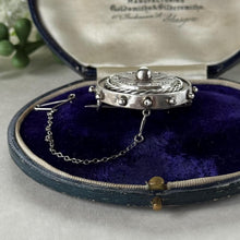 Load image into Gallery viewer, Antique Victorian Sterling Silver Keepsake Locket Brooch, Ship's Wheel Target Design. Aesthetic Movement Jewellery
