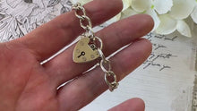 Load and play video in Gallery viewer, Vintage English Silver Curb Chain Bracelet With Love Heart Padlock
