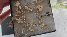 Charger et lire la vidéo dans la visionneuse de la Galerie, Vintage 1970s Georg Jensen Sterling Silver Curb Chain Charm Bracelet With 9 Charms &amp; Heart Padlock Clasp, All Original
