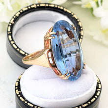 Load image into Gallery viewer, Vintage Blue Topaz 9ct Gold Cocktail Ring. 15ct Oval Step Cut Sky Blue Gemstone Ring. Large Topaz Solitaire Ring, 1969 Hallmark London
