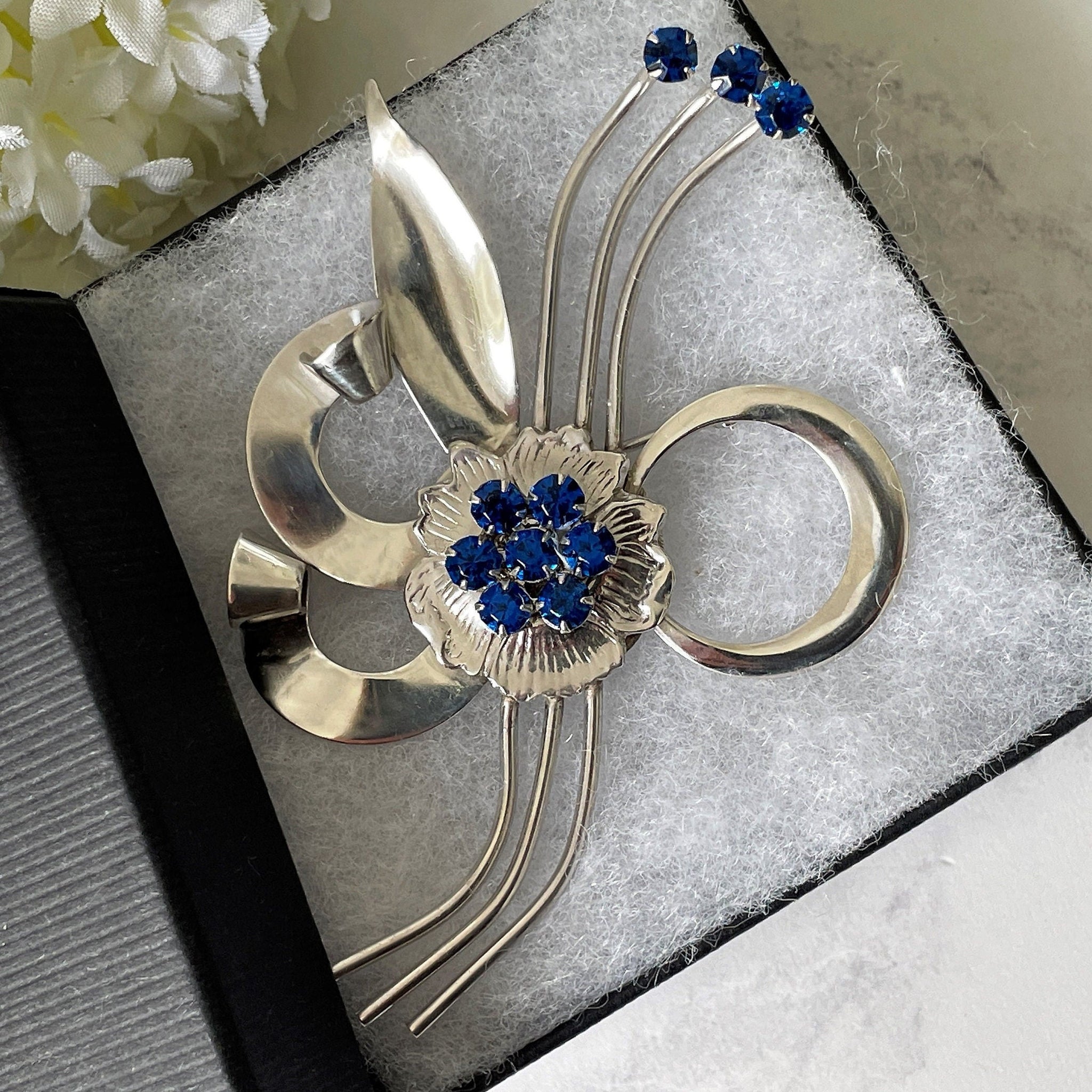 Vintage sterling blue rhinestone flower brooch outlet