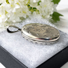 Load image into Gallery viewer, Antique Victorian Sterling Silver Locket. Aesthetic Engraved Lily &amp; Carnation 2-Sided Locket With Period Photos. Victorian Love Token Locket
