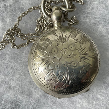 Load image into Gallery viewer, Antique English Silver Sovereign Case Locket Pendant Necklace. Edwardian Forget-Me-Not Engraved Round Puffy Keepsake Locket Pendant On Chain
